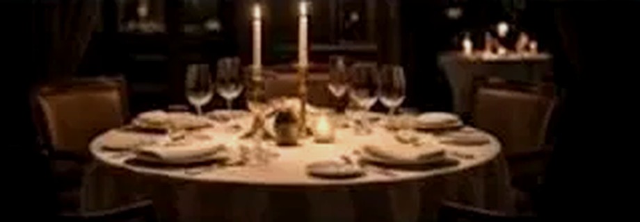 A candlelit Aurum dining room table